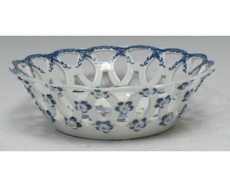 A Worcester Pine Cone pattern shaped circular basket, printed in underglaze blue with peony between two pine cones and a pome