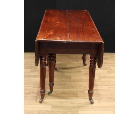 A George/William IV mahogany telescopic dining table, rounded rectangular fall leaves to ends, turned and fluted legs, two ad