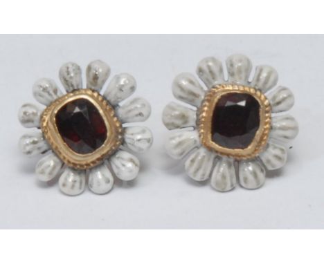 A pair of deep red garnet and enamel floral earrings, central irregular cut rectangular garnet collar set within white enamel