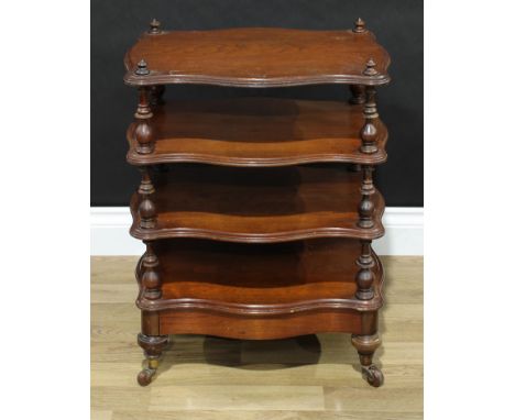 A Victorian serpentine low whatnot, turned supports and legs, drawer to base, ceramic casters, 65cm high, 51cm wide, 37.5cm d