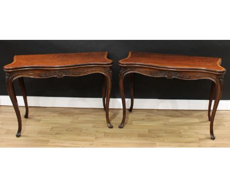 A pair of George III French Hepplewhite mahogany serpentine card tables, each crossbanded folding top outlined with chevron s