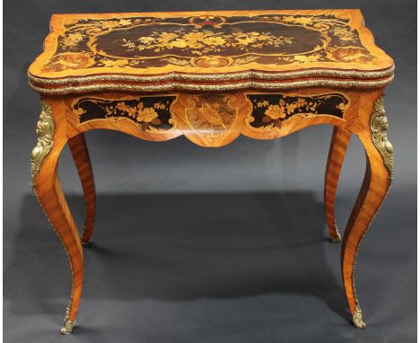 A 19th century Louis XV Revival gilt metal mounted kingwood and marquetry shaped rectangular card table, crossbanded top encl