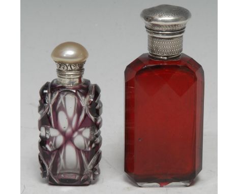 A 19th century silver-mounted and faceted ruby glass scent bottle, prismatic reservoir, milled mounted, screw-on cover, 9cm h