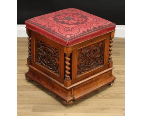 A Victorian walnut ottoman box stool, hinged stuffed over seat, blind fretwork sides, spirally turned columns to angles, conc