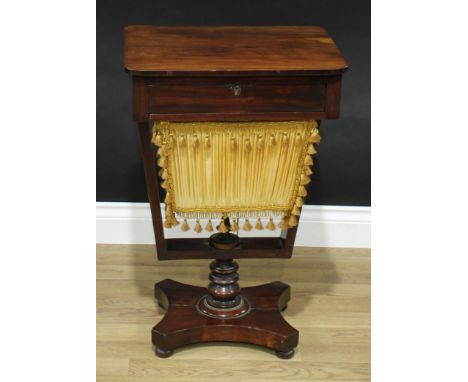 A William IV mahogany work table, rounded rectangular top above a frieze drawer and a basket undertier, turned pillar, incurv