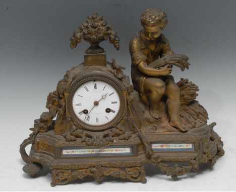 A French gilt metal figural mantel clock, the white enamelled idal with Roman numerals, inscribed, C. Detouche Fs de L'Empere