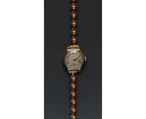 Rolex - a vintage 1930s ladies elongated octagonal 9ct gold bracelet wristwatch, silvered dial, Arabic numerals, minute track