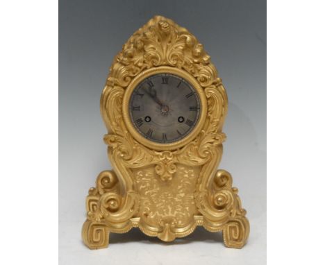 A French Louis Philippe Rococo Revival ormolu cartouche shaped mantel clock, 7c.5m circular silvered dial, with Roman numeral