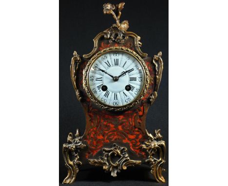 A French gilt metal mounted boulle cartouche shaped mantel clock, 9cm circular dial inscribed with Roman and subsidiary Arabi