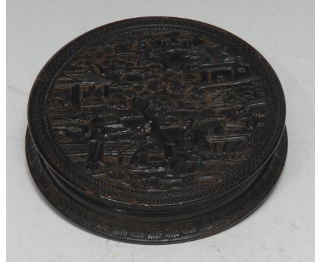 A 19th century Chinese tortoiseshell circular snuff box and cover, with scenes of traditional rural figures, temple-type stru