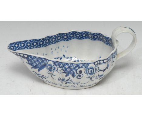A Worcester shaped sauceboat,  painted with the Full Moon pattern, cell border, scroll handle, 21cm wide, c.1760 