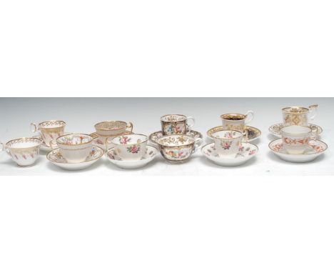 A Spode Pembroke shape coffee cup, teacup and saucer, pattern 4481, decorated with colourful summer flowers within a gilt car