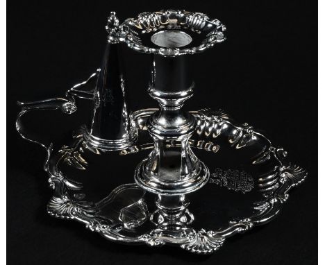 A William IV Rococo Revival silver chamberstick, the shaped base with bold shells and scroll borders, engraved with a coat of