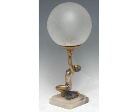 An Art Deco silvered and gilt  metal figural table lamp, as a dancer balancing a ball, globular crackle-glass shade, lozenge 