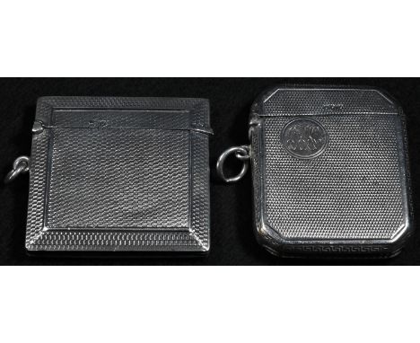 A George V silver rectangular vesta case, engine turned overall, hinged coverstriker to base, Cohen &amp; Charles, Birmingham