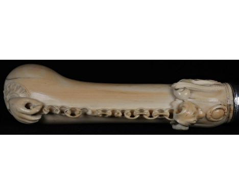 A 19th century silver-mounted ivory and malacca gentleman's walking stick, the shaped handle boldly carved with a hand holdin