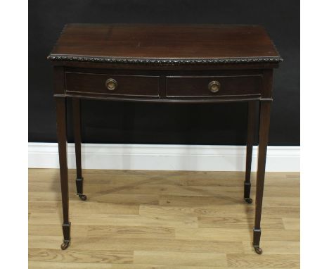 An Edwardian mahogany bow fronted card table, of George III design, folding top with carved edge enclosing an inset baize lin