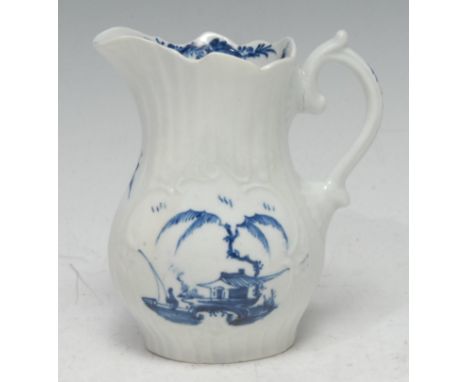 A Worcester moulded jug, painted in underglaze blue to front and verso with a man fishing in a rococo panel, 10cm high, c.177