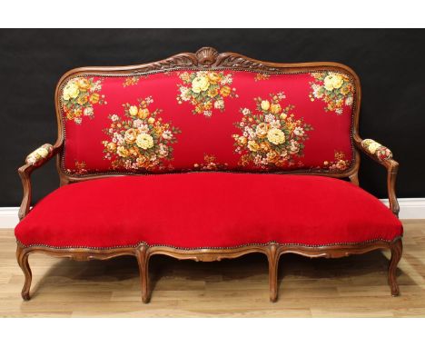 A 19th century mahogany sofa, in the French taste, shaped cresting rail carved with scrolling acanthus, stuffed over upholste