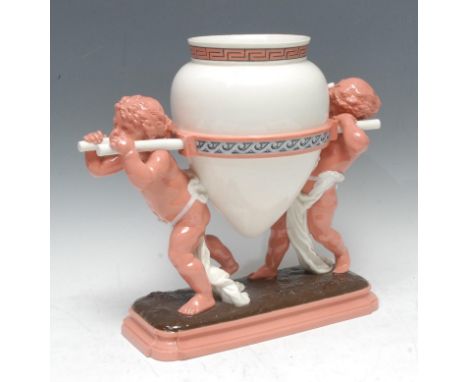 A Mintons centerpiece, modelled with two scantily clad cherubs carrying an oversize amphora, coloured in pink and brown, 30cm