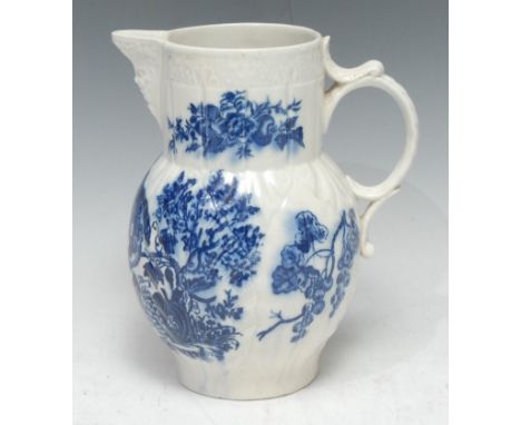 A Caughley cabbage leaf mask jug,  printed after Robert Hancock with Parrot Pecking Fruit, in underglaze blue,  19cm high, c.