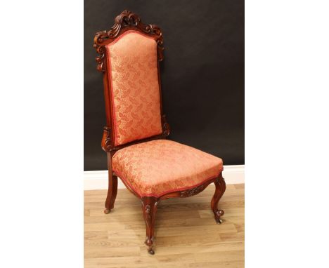 A Victorian mahogany nursing chair, shaped cresting rail pierced and carved with acanthus, stuffed over upholstery, cabriole 
