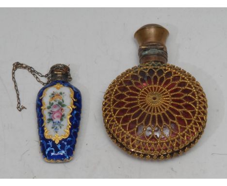 A 19th century silver coloured metal and enamel scent bottle, painted with sprays of summer flowers within shaped reserves on