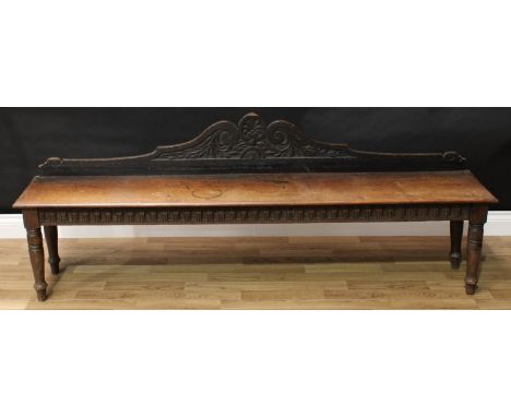 A Victorian oak hall bench, oversailing rectangular seat above a nulled frieze, turned legs, 43cm to floor, 183cm wide, c.188