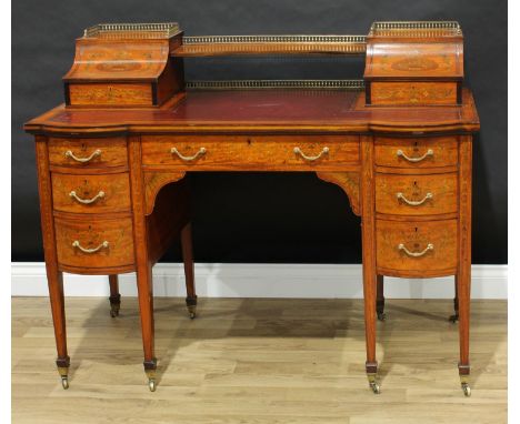 A Sheraton Revival satinwood and marquetry desk, the inverted 'Carlton House' superstructure with central niche flanked by a 