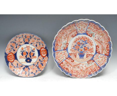 A large Japanese fluted Imari shaped circular charger, 39cm diam, Meiji period;  another, smaller, 30cm diam, Meiji period 