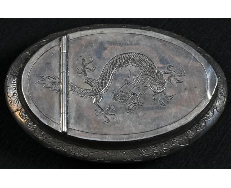 A Chinese silver oval snuff box, curved hinged cover engraved with a dragon, the side with stiff foliage, 9.5cm wide, maker?s