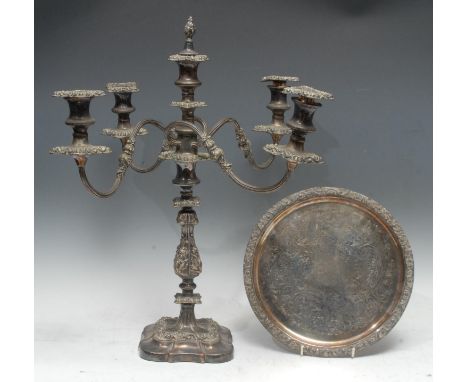 A late 19th century silver plate on copper five light four branch table candlestick, detachable foliate embossed sconces, cam