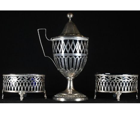 A pair of French silver open oval salts, pierced sides, blue glass liners, 8cm wide, c.1890 ; a French silver pedestal urnula