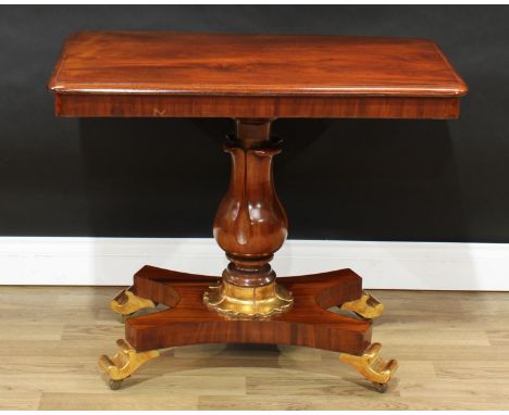 A William IV mahogany and parcel-gilt pedestal centre table, rounded rectangular top, baluster pillar, lotus socle, incurve c