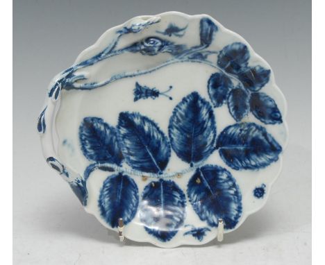 A Worcester Blind Earl twig handled scalloped circular dish,  moulded in relief with two flower buds and leaves, painted in u