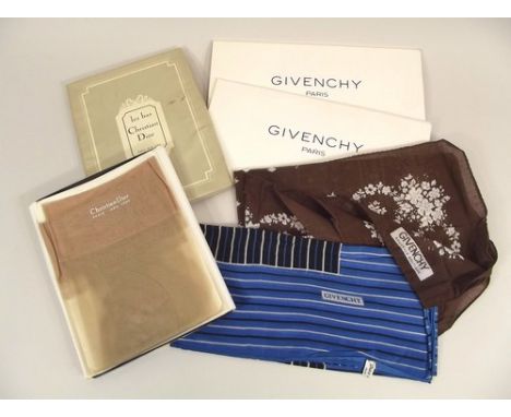 CHRISTIAN DIOR & GIVENCHY.
A pair of Christian Dior unused stockings & two Givenchy printed cotton scarves, in original packa