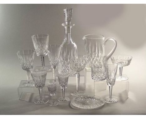 WATERFORD CRYSTAL SUITE.
A suite of Waterford Crystal in the Lismore pattern, comprising a decanter, 33.5cm, a water jug, 16.