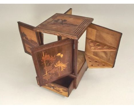 JAPANESE CABINET.
A Japanese inlaid smoker's cabinet with four doors & a drawer.
24x16x16cm.