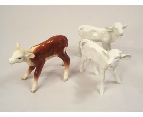 BESWICK & GOEBELS.
A Beswick calf, height 11cm & two white glazed Goebel calves.