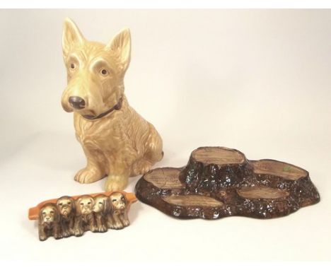 BESWICK & SYLVAC.
A Beswick stand, width 32cm, a Beswick novelty ashtray, No.869 & a Sylvac fireside dog, 27cm (damage)