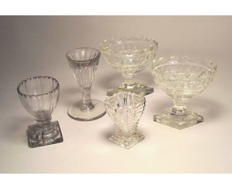 TABLE SALTS ETC.
A pair of 19th century cut glass table salts, a moulded glass vase, a fluted drinking glass & one other glas