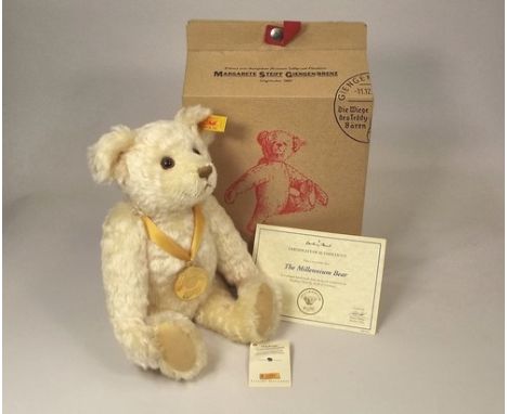 STEIFF MILLENNIUM BEAR.
A Steiff mohair Millennium bear, with medal, ear button, original label, certificate & box.
Height 29