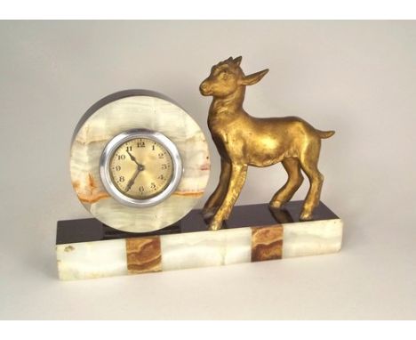 FRENCH CLOCK.
An Art Deco French onyx mantel clock, with spelter kid ornament.
Length 23cm.