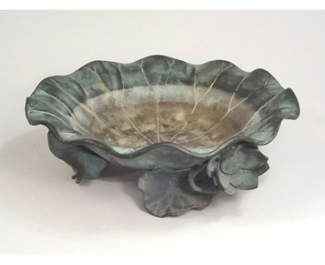 JAPANESE BRONZE BOWL.
A Japanese Meiji period bronze, lily pad bowl, supported on three lily blossom & pad feet, the base wit