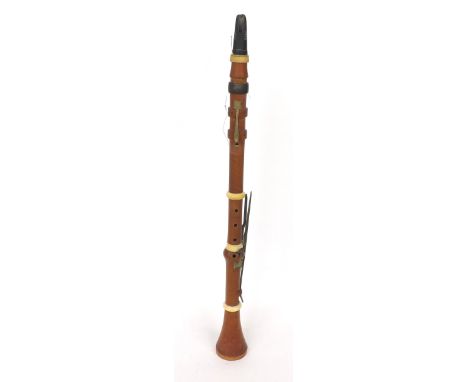 Boxwood and ivory clarinet by and stamped W. Milhouse, London, with five square brass keys on wooden blocks 