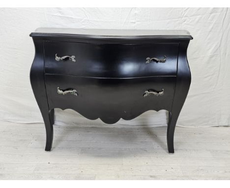 A contemporary ebonised bombe form commode chest. H.88 W.120 D.55cm. 