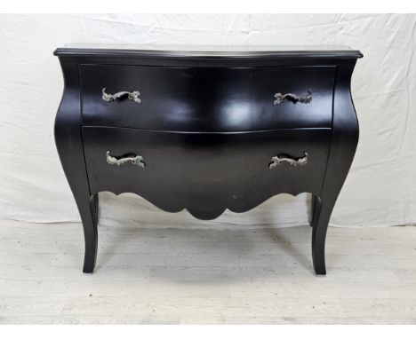 A contemporary ebonised bombe form commode chest. H.88 W.120 D.55cm. 