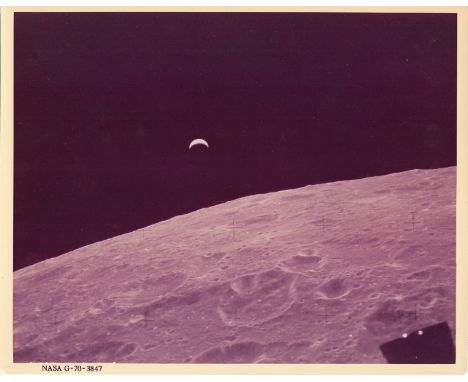 Space.-  Crescent Earthrise, Apollo 12, 14-24 November, 1969, vintage chromogenic print on fibre-based Kodak paper, NASA G-70