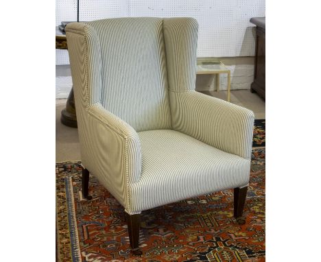 WING ARMCHAIR, 100cm H x 68cm W, Edwardian, newly upholstered in ticking on ceramic castors. 
