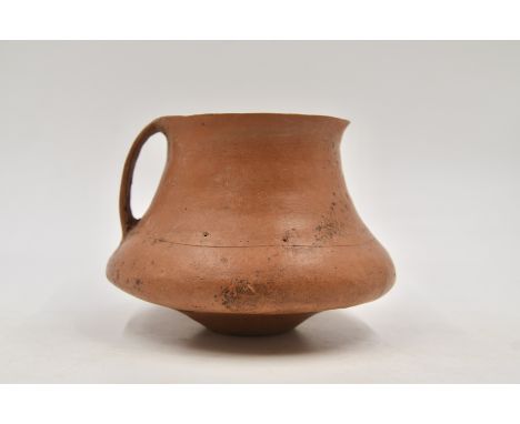 A Large Red Pottery Handled Cup, Neolithic period, Qijia culture, 2050 - 1700 B.C.Reference.For a similar large pottery cup, 